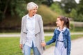 Grandmother and granddaughter walking at park Royalty Free Stock Photo