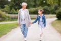 Grandmother and granddaughter walking at park Royalty Free Stock Photo