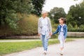 Grandmother and granddaughter walking at park Royalty Free Stock Photo