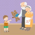 Grandmother and grandfather give a grandson a teddy bear