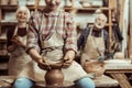 Grandmother and grandfather with granddaughter making pottery Royalty Free Stock Photo