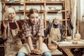 Grandmother and grandfather with granddaughter making pottery Royalty Free Stock Photo