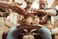 Grandmother and grandfather with granddaughter making pottery Royalty Free Stock Photo