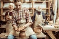 Grandmother and grandfather with granddaughter making pottery Royalty Free Stock Photo