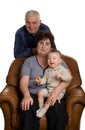 Grandmother, grandfather and grandson sitting in a