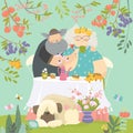 Grandmother and grandfather have lunch in blossom garden
