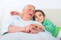 Grandmother and grandson in bed Royalty Free Stock Photo