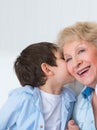 Grandmother with grandson having fun at home