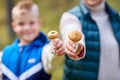 grandmother and grandson with mushrooms in forest