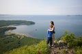 Grandmother and grandson standing on top of a mountain