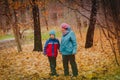 Grandmother with grandson walk in autumn fall nature Royalty Free Stock Photo