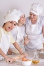 Grandmother and grandsons cooking together