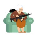 Grandmother with gun. old woman in an armchair with tommy gun an Royalty Free Stock Photo