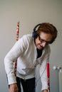 grandmother with headphones having fun with a podcast