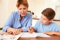 Grandmother Helping Grandson With Homework