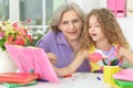 Grandmother helping her granddaughter doing homework Royalty Free Stock Photo