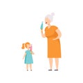 Grandmother and her little granddaughter eating ice cream in wafer cone, people enjoying eating of frozen summer dessert
