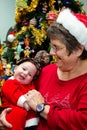 Grandmother Holding Baby On Christmas Royalty Free Stock Photo