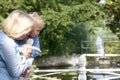 Grandmother holding baby girl outdoors Royalty Free Stock Photo