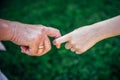 Grandmother holding grandchild hand in nature. National Grandparents Day, family concept. Two generations. The old woman Royalty Free Stock Photo