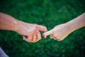 Grandmother holding grandchild hand in nature. National Grandparents Day, family concept. Two generations. The old woman`s hand Royalty Free Stock Photo