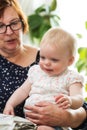 Grandmother holding her grandchild, happy family Royalty Free Stock Photo