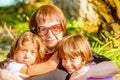 Grandmother holding her two Granddaughters Royalty Free Stock Photo