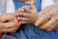 Hands of granddaughter with grandmother