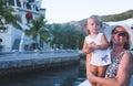 Grandmother hugging granddaughter legs and smiling Royalty Free Stock Photo