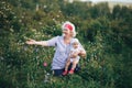 Grandmother Hugging granddaughter In nature in sunny summer day Royalty Free Stock Photo