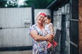 Grandmother Hugging granddaughter In nature in sunny summer day Royalty Free Stock Photo