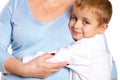 Grandmother hugging her grandson on a white background Royalty Free Stock Photo