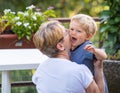 Grandmother hugs and gently kisses Royalty Free Stock Photo