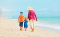 Grandmother with kids- little boy and girl- at beach Royalty Free Stock Photo
