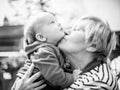 Grandmother kiss her grandson, love moment Royalty Free Stock Photo