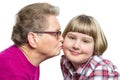 Grandmother kisses grandchild on cheek Royalty Free Stock Photo