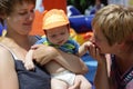 Grandmother kissing hand her grandson Royalty Free Stock Photo