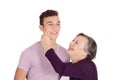 Grandmother kissing her teen grandson on the cheek Royalty Free Stock Photo