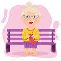 Grandmother knits sitting on a bench. Elderly people