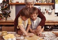 Grandmother, learning and kids baking at Christmas in kitchen, teaching and boys bonding together in family home Royalty Free Stock Photo