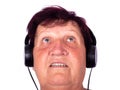 Grandmother listens to psychedelic music on headphones,concept 60 year old grandma is listening to a song