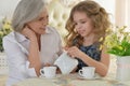 Grandmother with little girl drinking tea Royalty Free Stock Photo