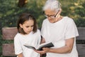 Grandmother and little girl reading holy bible. Study the holy bible together Royalty Free Stock Photo