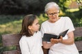 Grandmother and little girl reading holy bible. Study the holy bible together Royalty Free Stock Photo