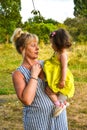 Grandmother, Mother And Daughter Relaxing In Park. Three generations are playing together in the garden. Royalty Free Stock Photo