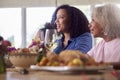 Grandmother With Mother And Granddaughter Enjoying Multi-Generation Family Meal At Home Royalty Free Stock Photo