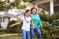 Grandmother Playing Soccer In Garden With Granddaughter Royalty Free Stock Photo