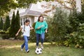 Grandmother Playing Soccer In Garden With Granddaughter Royalty Free Stock Photo