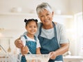 Grandmother, portrait or child baking in kitchen as a happy family with young girl learning cookies recipe. Mixing cake Royalty Free Stock Photo