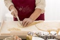 Grandmother preparing traditional pasta